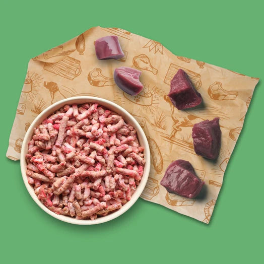 a bowl of Dibo mince with meat pieces on a patterned background