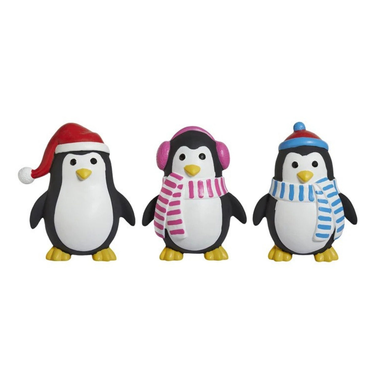 Three penguin latex dog toys wearing winter hats and scarves, shown side by side on a plain white background. One penguin wears a red Santa hat and red-and-white striped scarf, the middle wears pink earmuffs and a pink-and-white striped scarf, and the right wears a blue-and-white striped beanie and blue-and-white striped scarf.