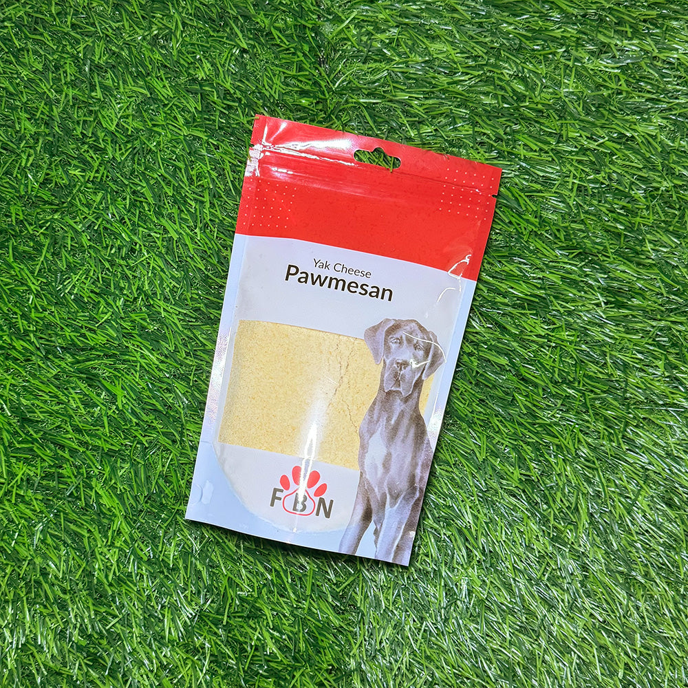 Package of Yak Cheese Pawmesan on a grassy background