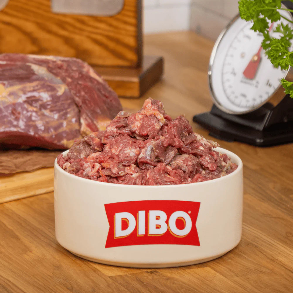 DIBO branded bowl with ground meat on a wooden surface