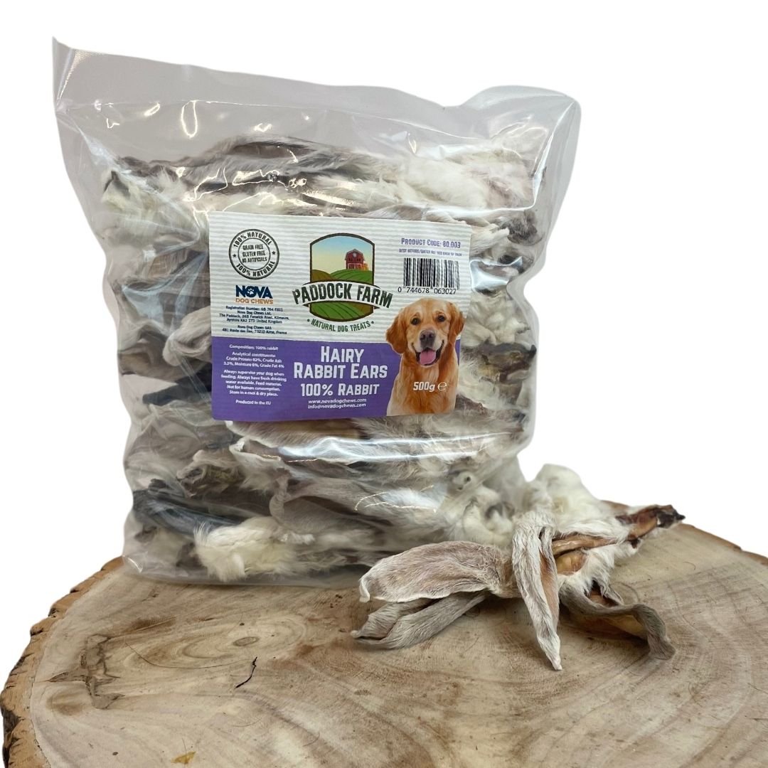 500g bag of natural hairy rabbit ear dog treats on a wooden display.