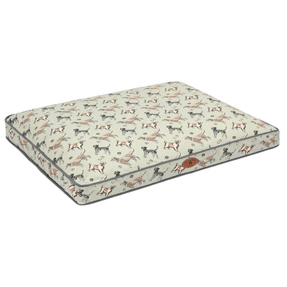 A rectangular dog bed with a cream-colored fabric cover featuring a repeating pattern of various dog breeds in black, brown, and tan. The bed is finished with dark gray piping and has a small brown leather brand patch on the side.