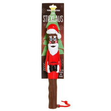 Sticklaus dog toy, featuring a Santa Claus figure on a brown tree trunk handle with a red hanging loop, shown on its retail backing card against a white background.