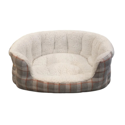 A round pet bed featuring a plush cream sherpa fleece lining and a gray and orange plaid fabric outer shell, shown against a plain white background.