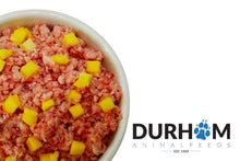 Dog food with mango chunks in a bowl, branded with Durham Animal Feeds.
