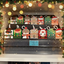Set of Christmas-themed mini boxes on a shelf