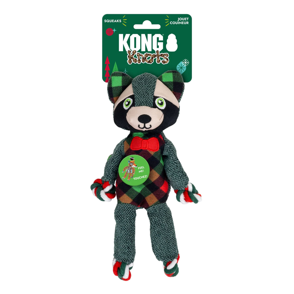 Kong Raccoon Squeaks plush dog toy in retail packaging, featuring a raccoon dressed in a red, green, and black plaid outfit with a red bow tie