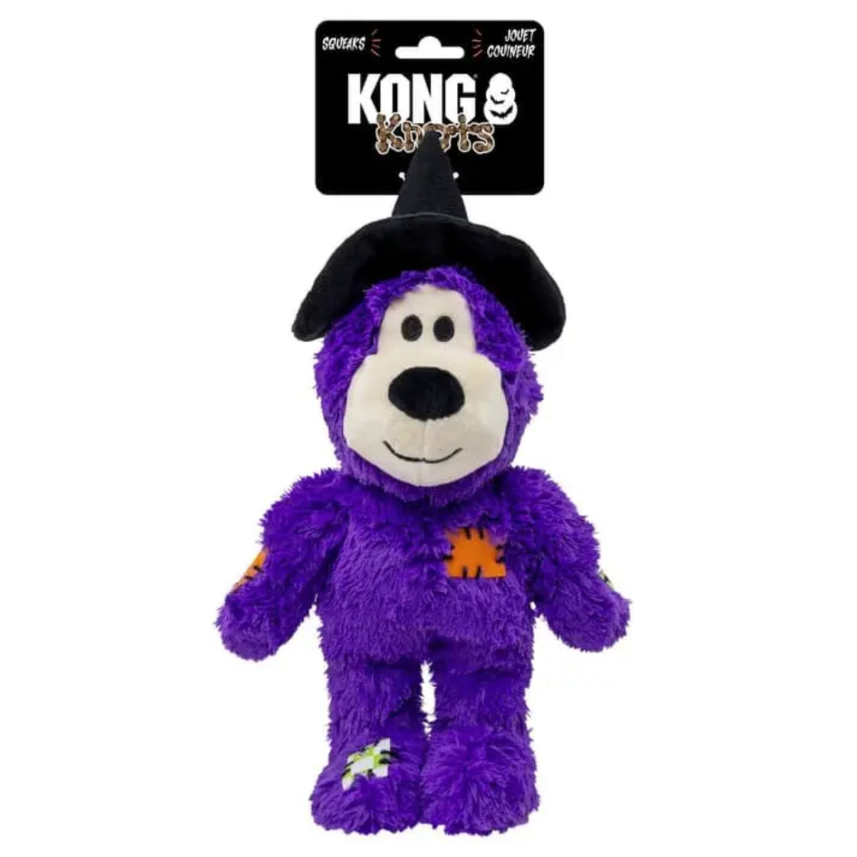 A purple plush dog toy wearing a black witch hat, attached to a black KONG Pet Toys retail header card, on a plain white background.