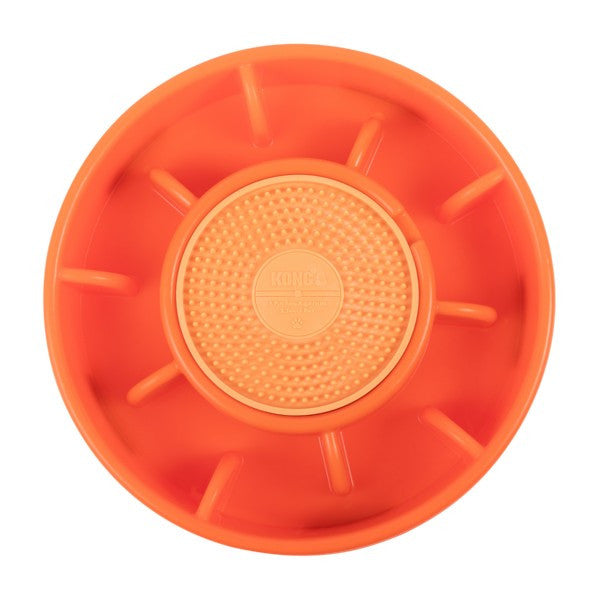 Orange plastic wheel with textured center on a white background