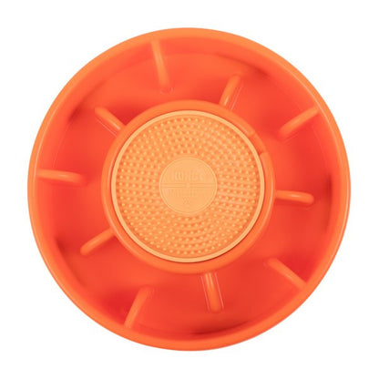 Orange plastic wheel with textured center on a white background