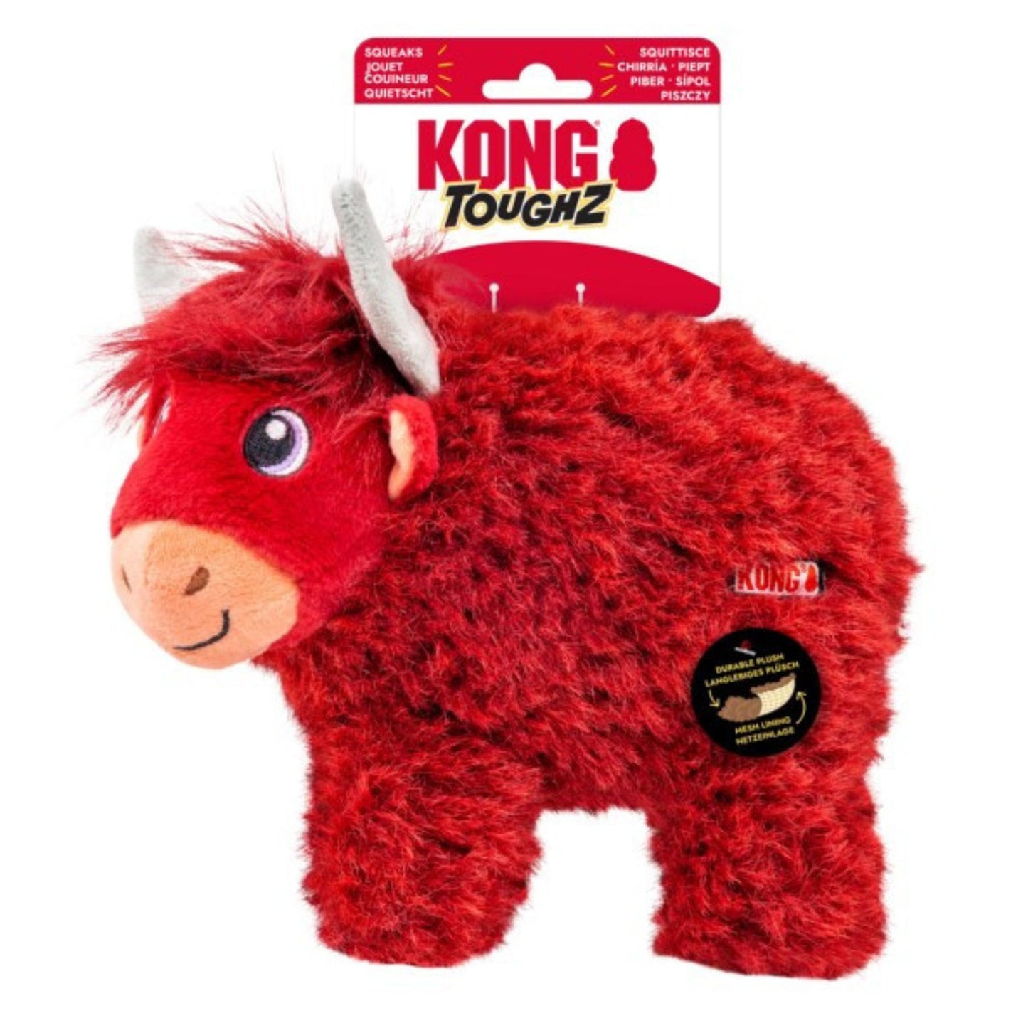 Kong Toughz red fluffy highland cow dog toy in its original retail packaging, featuring a red plush body, white horns, and a black circular product info sticker on the side.
