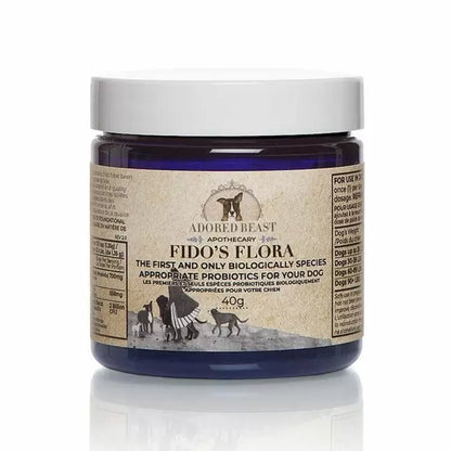 Adored Beast Fido's Flora probiotics for dogs in a blue tub with white lid on a white background
