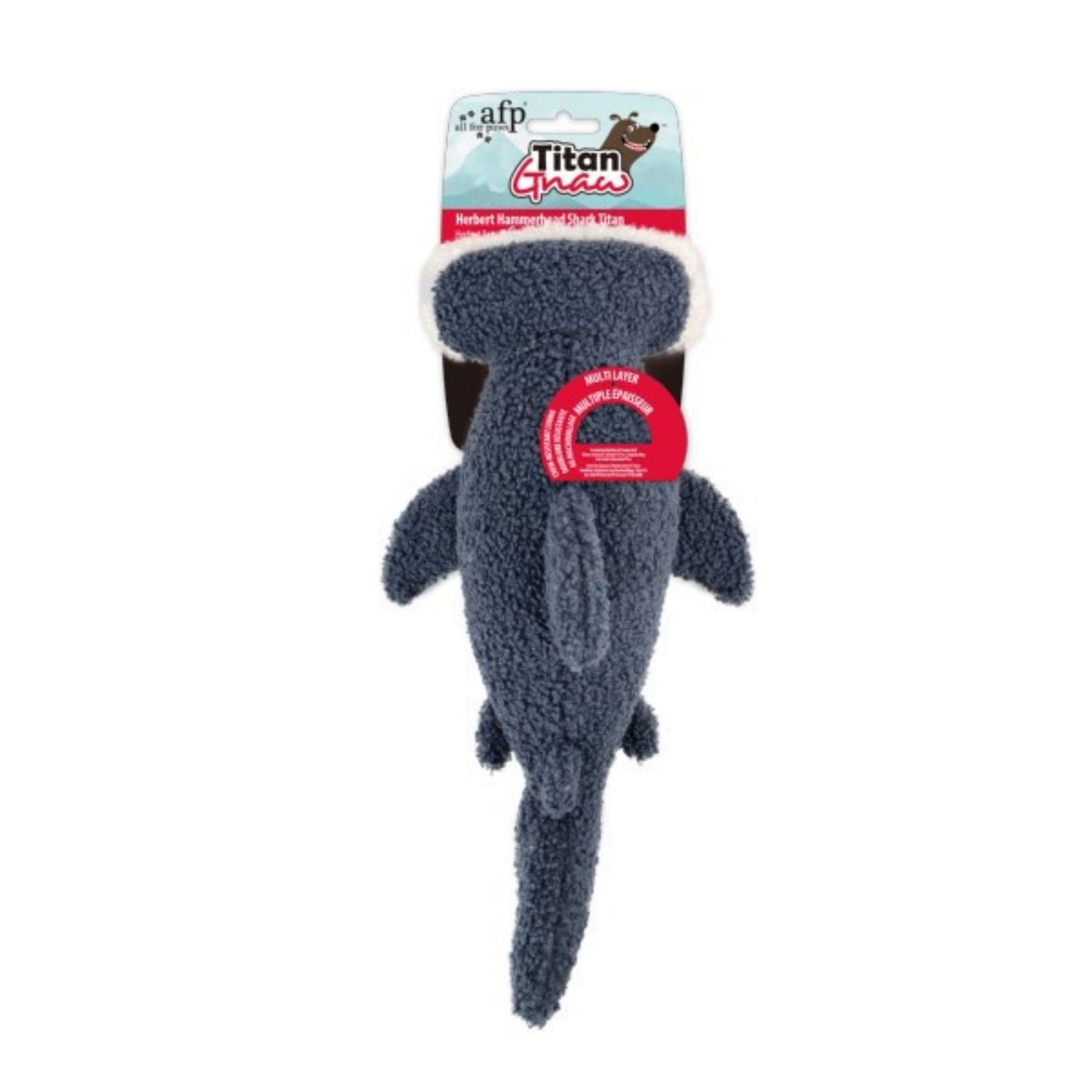 Dog toy shaped like a shark with packaging on a white background