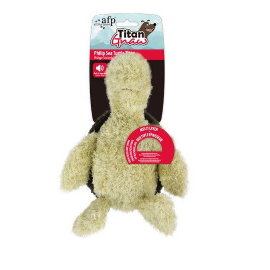 Plush turtle toy with packaging on a white background