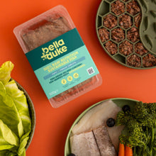 Packaged food product with bella+duke branding on an orange background