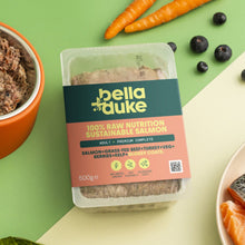 Packaged food with bella+duke branding on a green and beige background