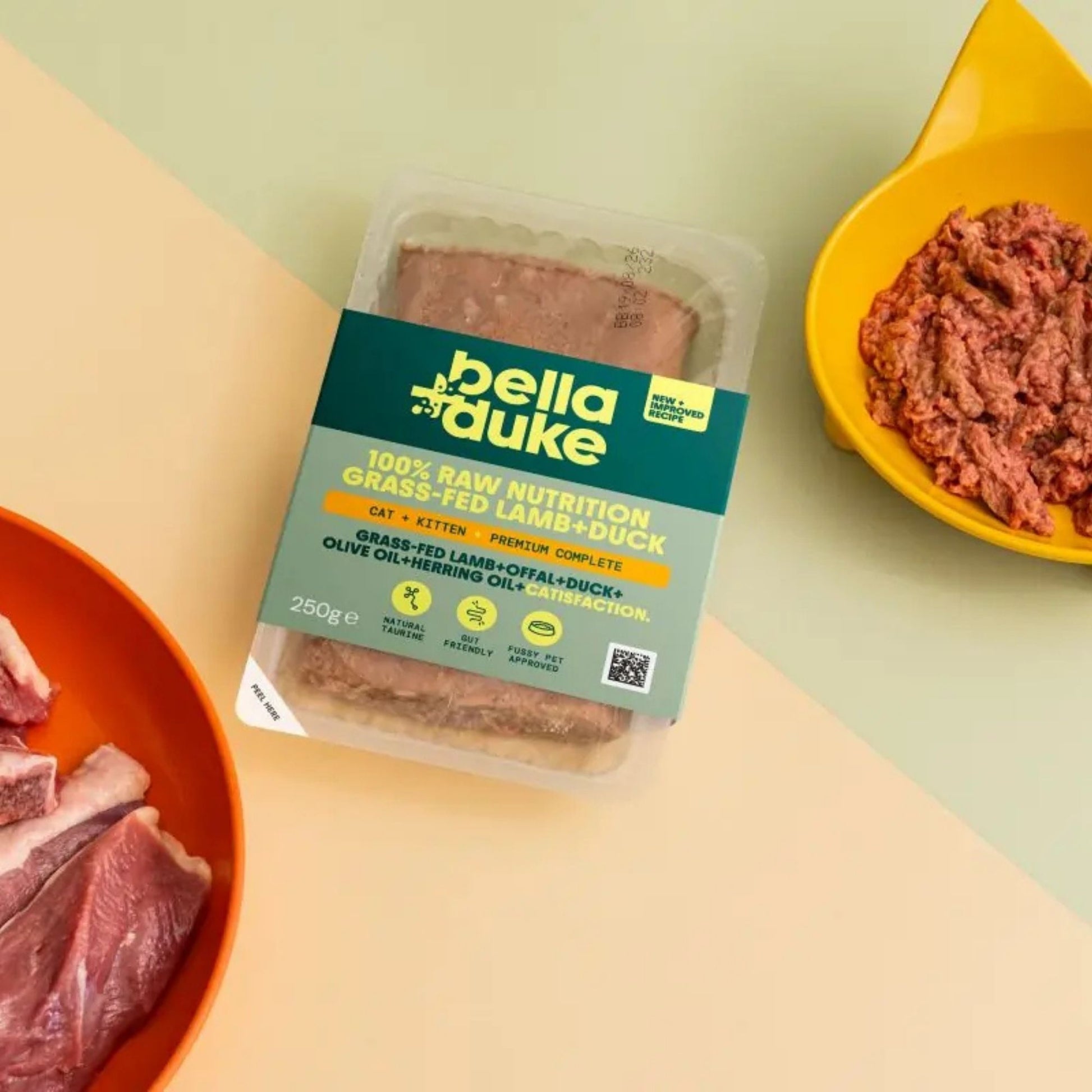 Packaged food with Bella Duke label on a table with raw meat.