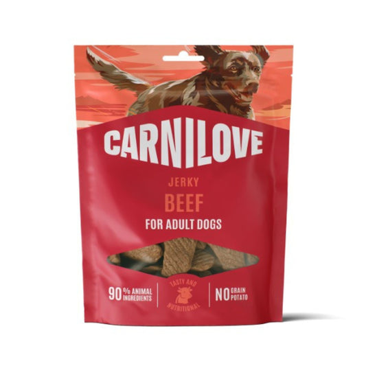 Carnilove Jerky Beef dog treats in a red stand-up pouch with a dog illustration at the top and a clear window showing the treats inside.