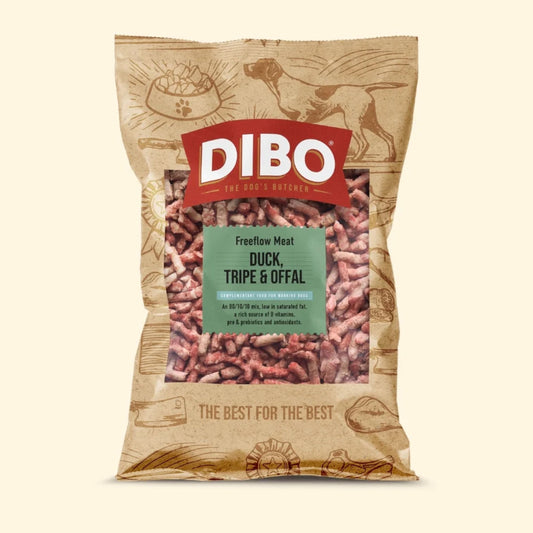 A bag of Dibo Freeflow Meat dog food, specifically Duck, Tripe & Offal, in a brown kraft paper bag with a red Dibo logo and a green label, shown on a light beige background.