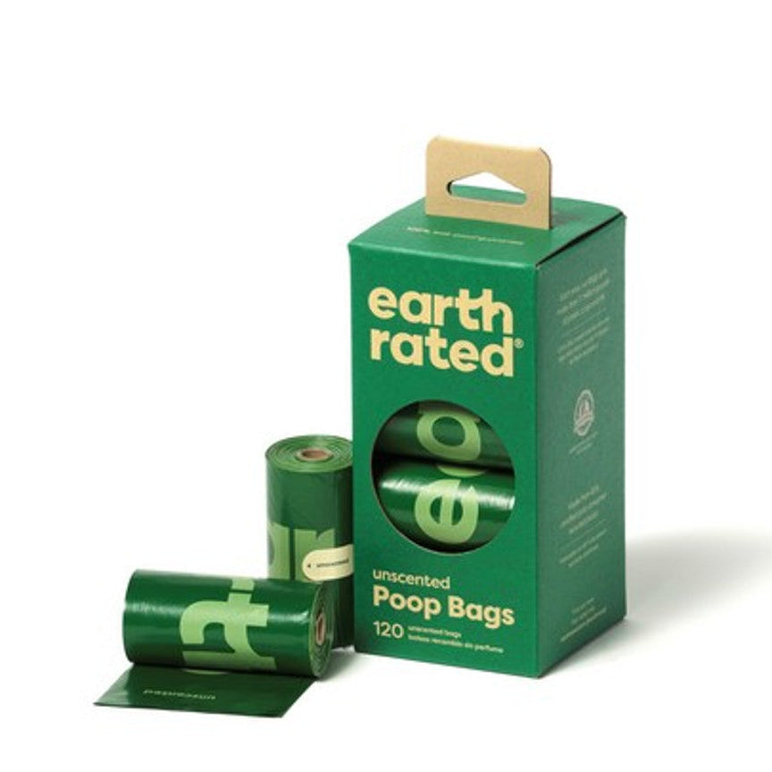 A box labeled 'Earth Rated' next to a roll of poop bags with some bags spilling out. The packaging indicates the product is for 120 bags in total, with 8 rolls of 15 bags each.