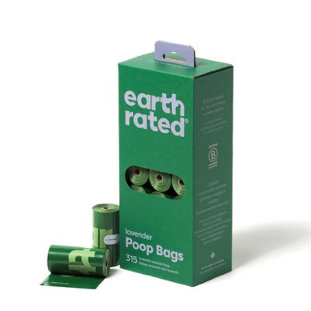 A green box of Earth Rated Poop Bags with several rolls of dog waste bags displayed in front.