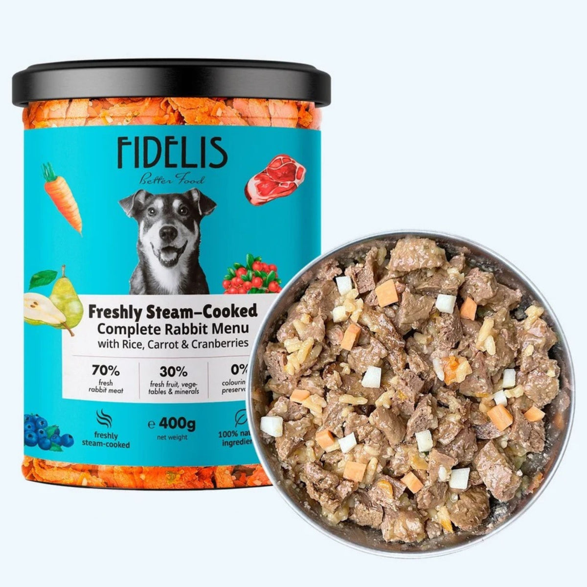 A jar of FIDÉLIS premium rabbit food with a black lid and turquoise label, shown next to a metal bowl filled with the cooked rabbit food. The label reads 'Freshly Steam-Cooked Complete Rabbit Menu with Rice, Carrot & Cranberries' and shows a dog illustration.