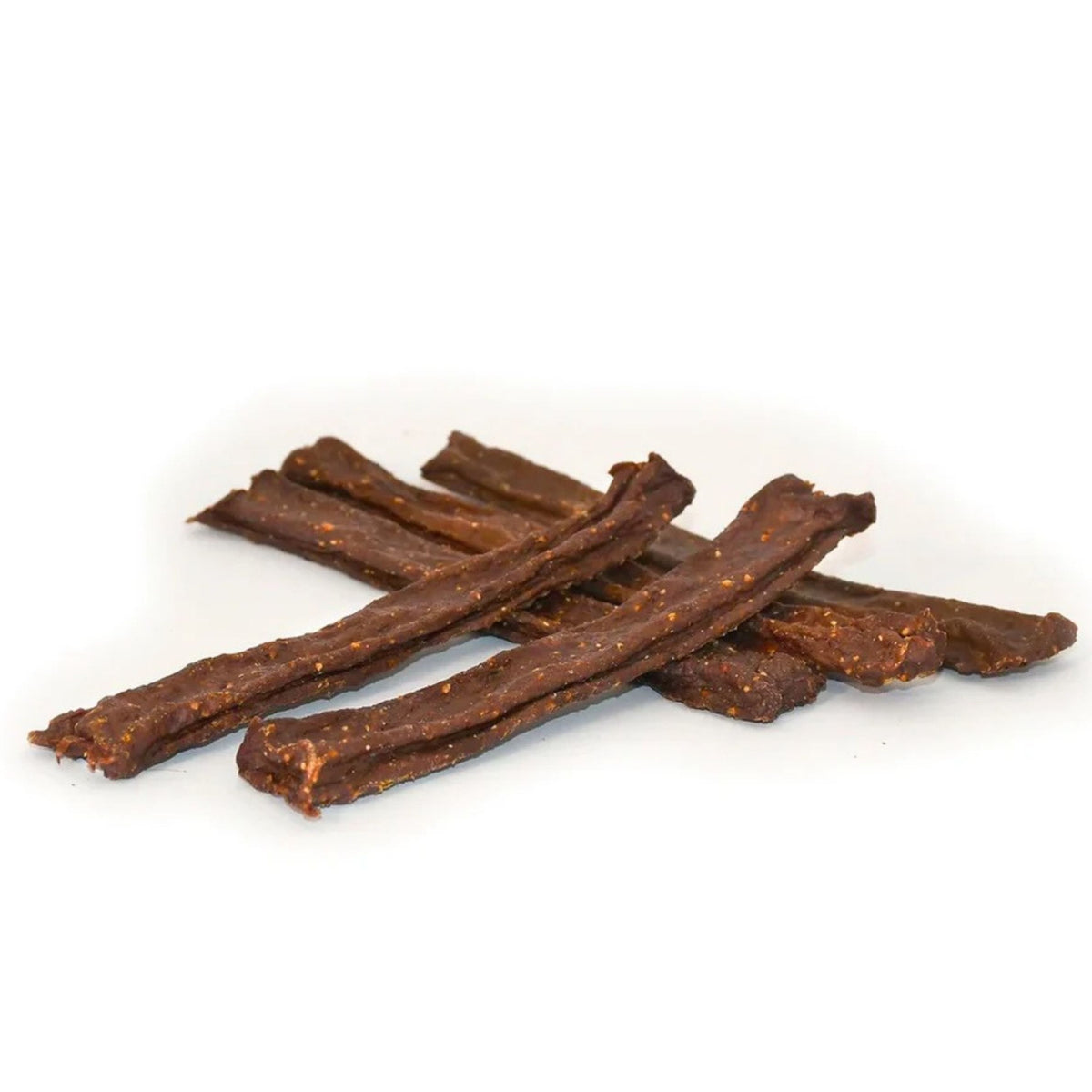 Several brown dried meat sticks or jerky strips arranged in a small pile on a plain white background.