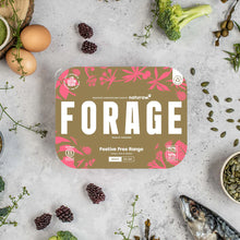 Naturaw Forage packaging on a gray surface with fresh produce