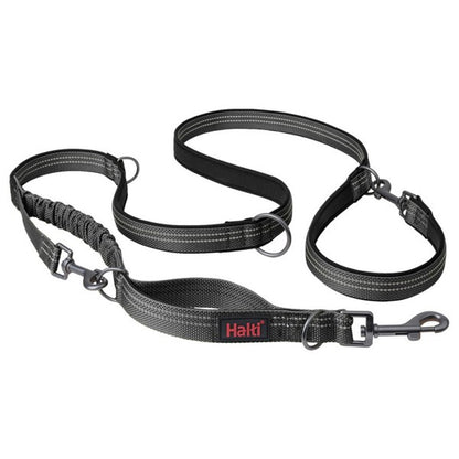 A grey Halti branded double-ended dog leash with metal clips and padding.