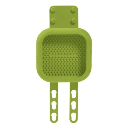 A green lickimat with two adjustable hook-style arms, shown on a plain white background.