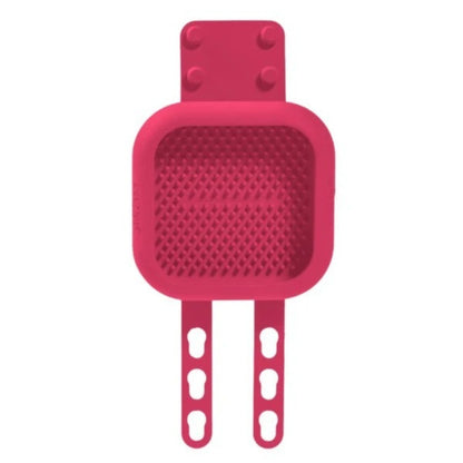 A bright pink lickimat with two adjustable hook-style arms, shown on a plain white background.