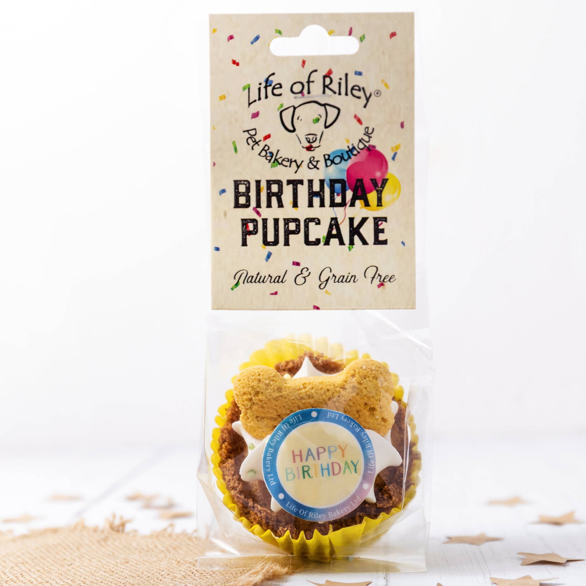 Dog treat packaging labeled 'Birthday Pupcake' by 'Life of Riley' on a white background.