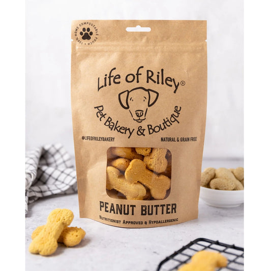 Bag of Life of Riley Pet Bakery & Boutique peanut butter dog treats on a white surface.