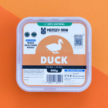 Mersey Raw duck food packaging on an orange background