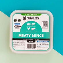 Mersey Raw Meaty Mince dog food in a square white plastic tub with a colorful label, set against a diagonally split teal and pale green background.