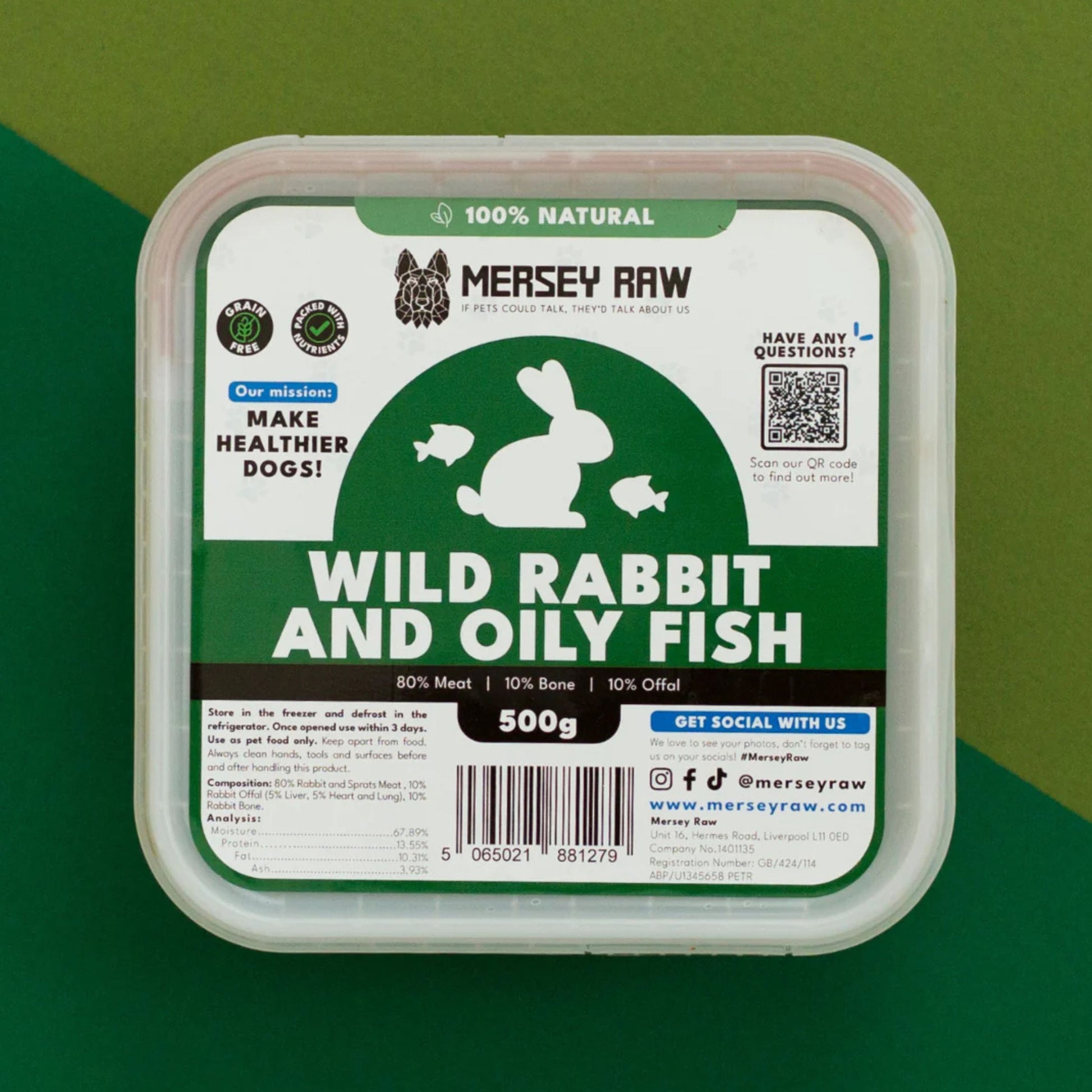 Mersey Raw dog food container with a clear plastic lid and a white label featuring green and black graphics. The label reads 'Wild Rabbit and Oily Fish' and '500g'.