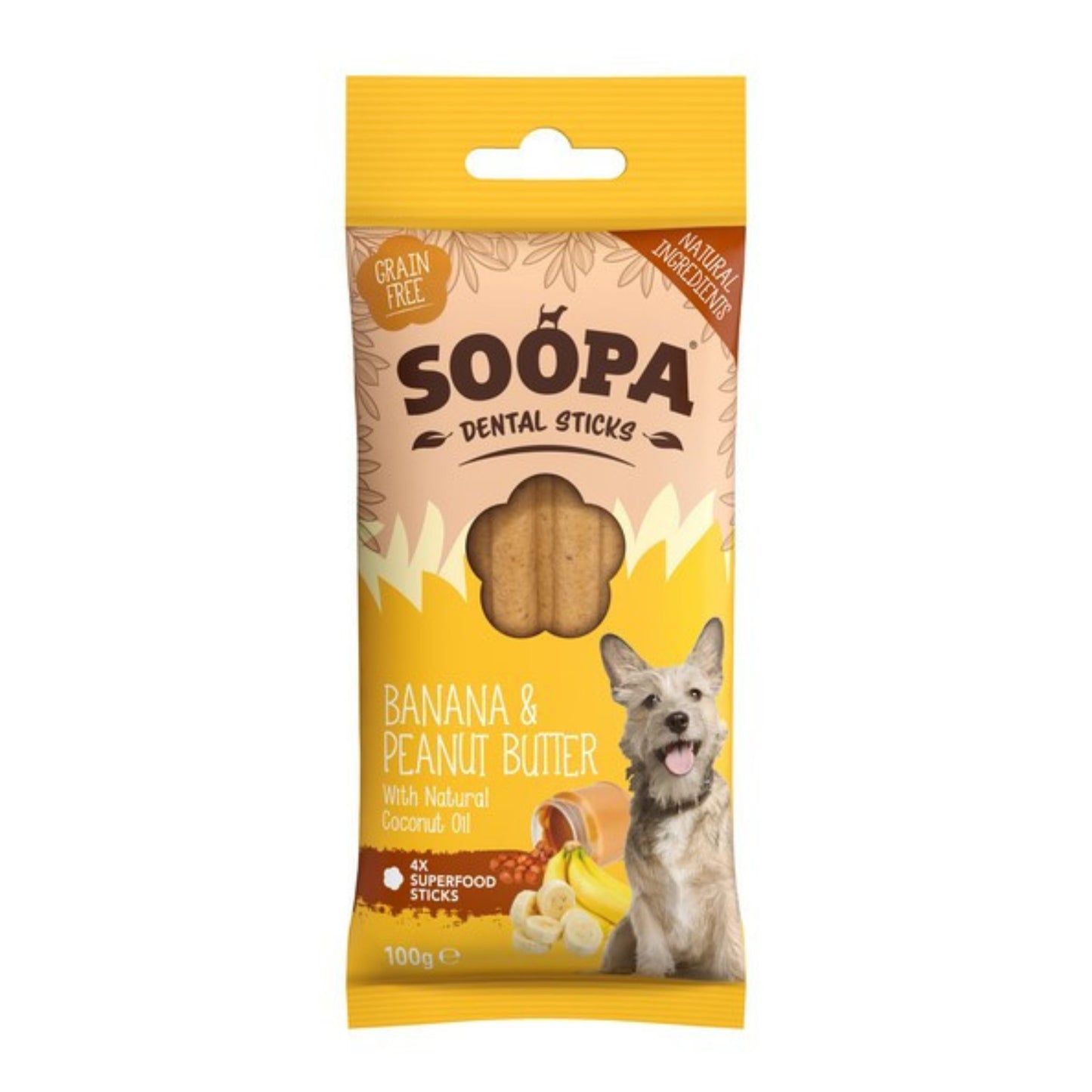 A package of Soopa Dental Sticks dog treats, Banana & Peanut Butter flavor, featuring a yellow and beige bag with a picture of a dog and a clear window showing the treats inside.