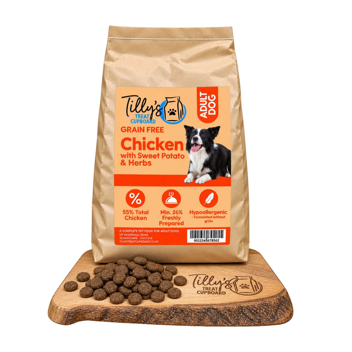 A bag of Tilly's Treat Cupboard Grain Free Adult Dog food in chicken flavour, displayed on a wooden cutting board with kibble pieces in front, against a white background.